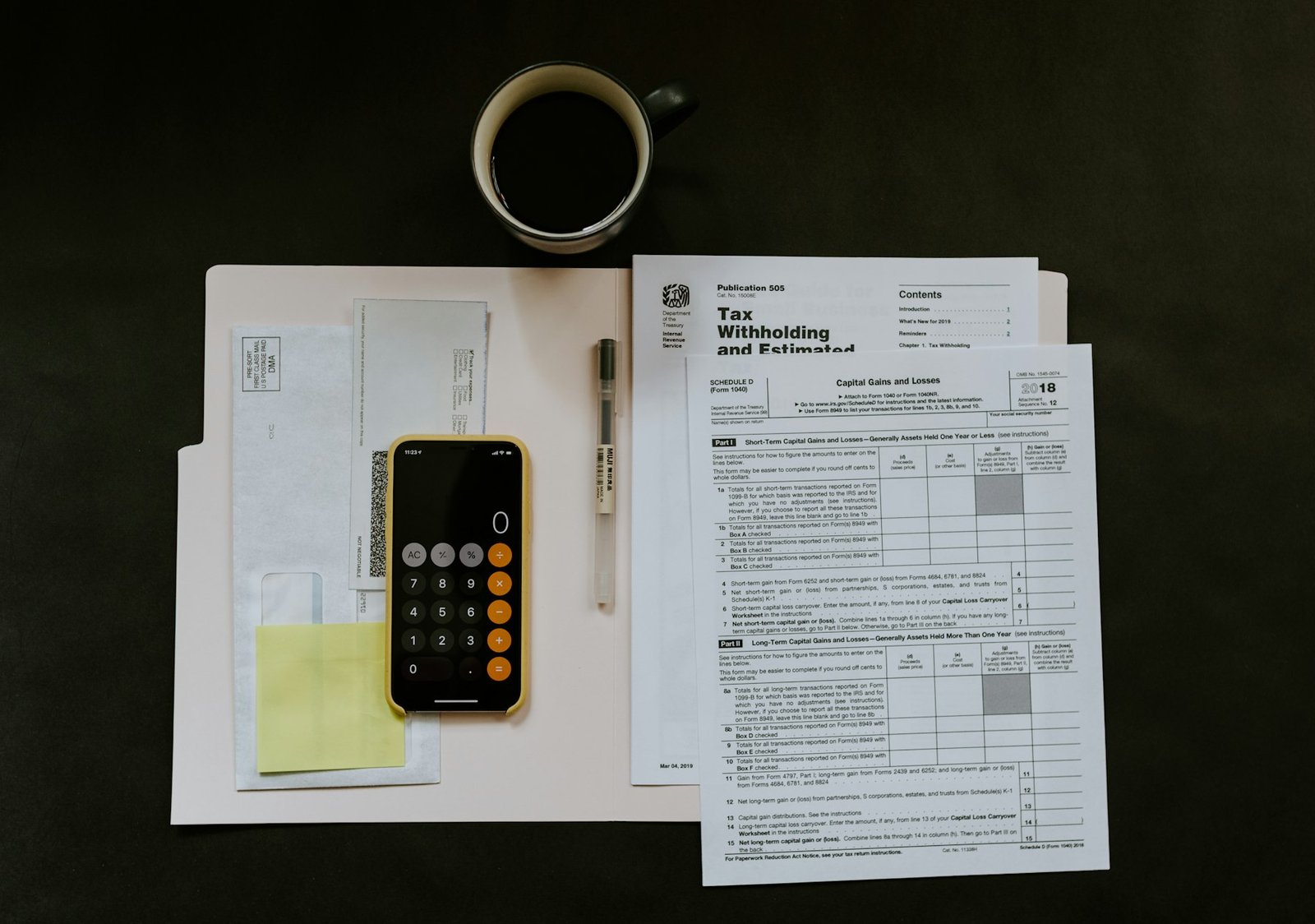 A person working through figures with a calculator
