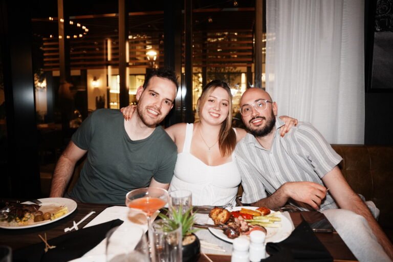 Apex team members at dinner during a company trip