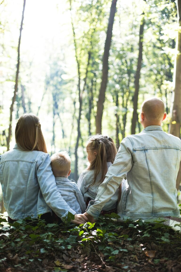 A family walking together under trees